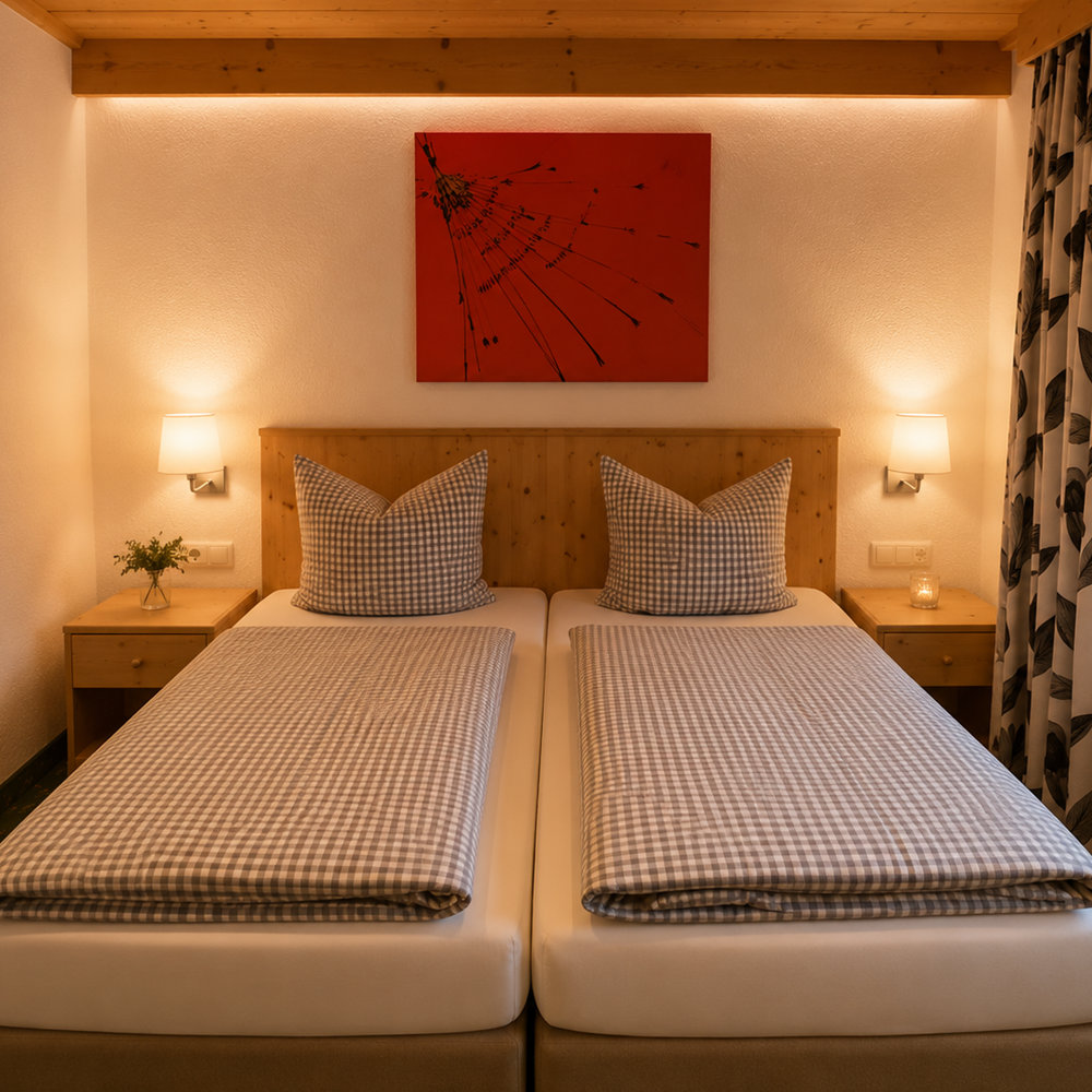 Bett der Ferienwohnung im Bergheim Tirol